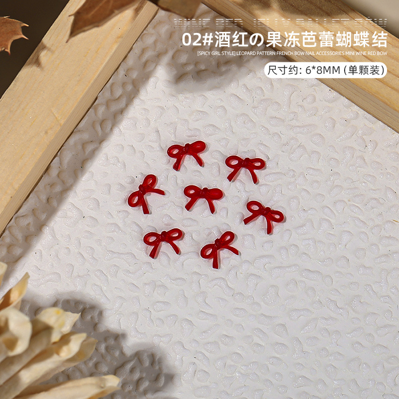 Hot Girl estampado leopardo arco francés joyas de resina de manicura vino rojo mini arco decoración de uñas al por mayor
