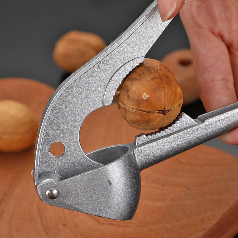 Triturador de nueces y frutos secos para el hogar, prensa manual de ajo, triturador de pasta de ajo, abridor de cáscaras, herramienta de cocina multifuncional. image 4