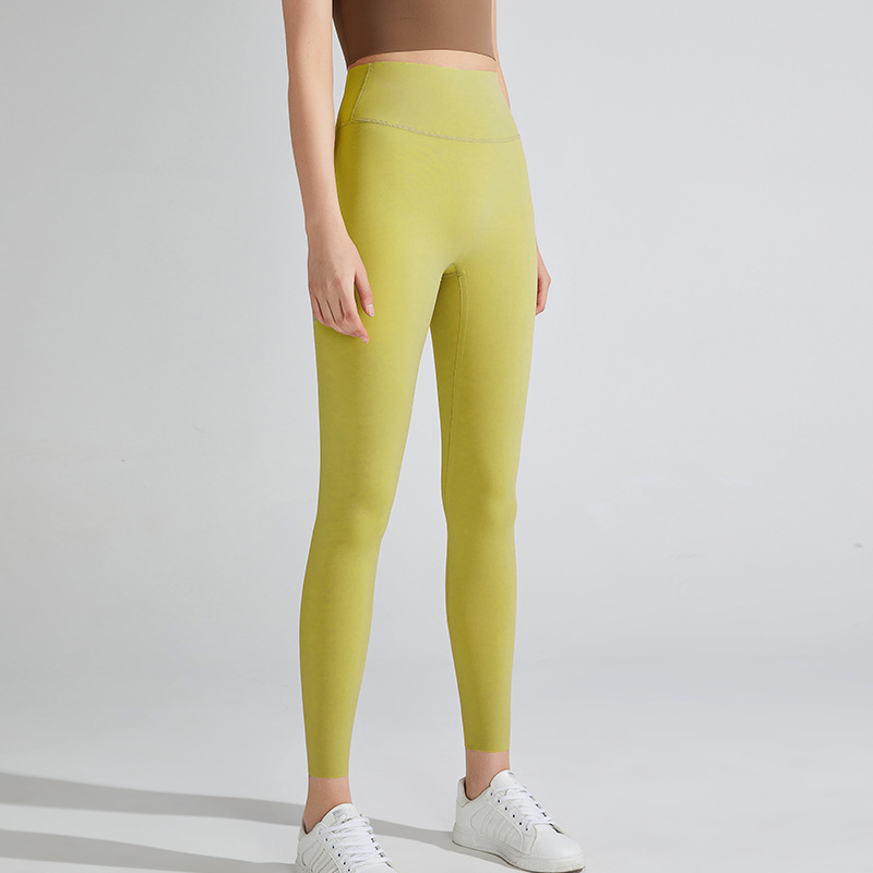 Nuevos pantalones de yoga desnudos transfronterizos Lycra de cintura alta de mujer pantalones de fitness de levantamiento de cadera deportes al aire libre ropa de yoga ajustada de secado rápido