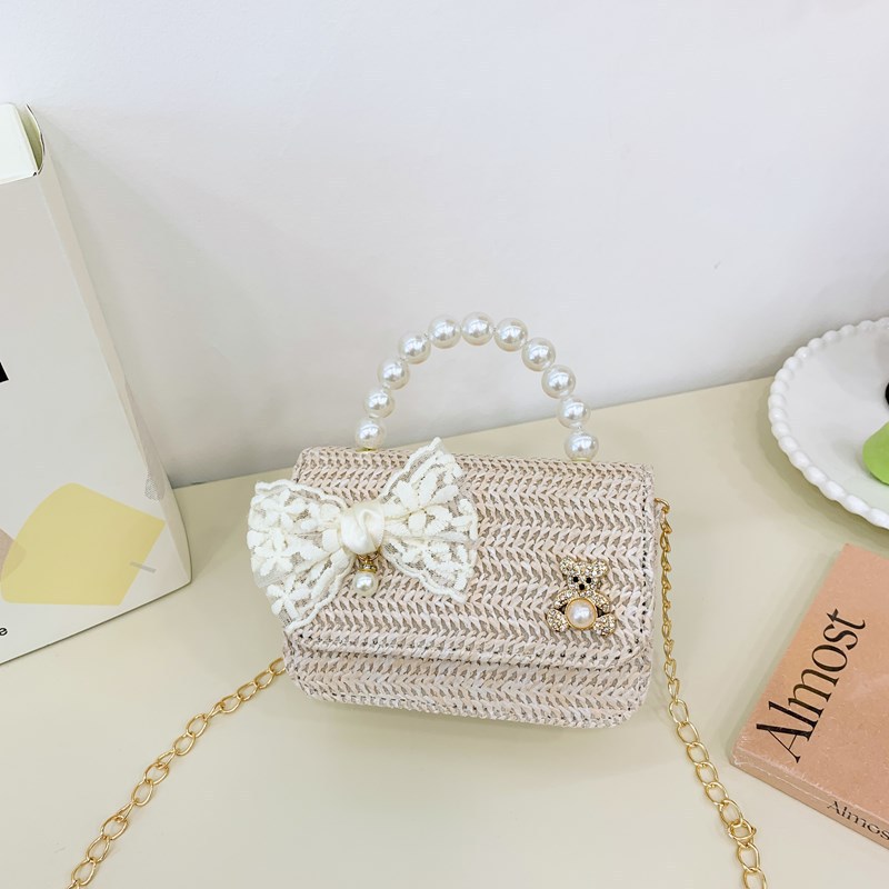 Verano nuevo arco de paja bolso de perla bolso de moda para niños bolso de princesa de jardín de infantes