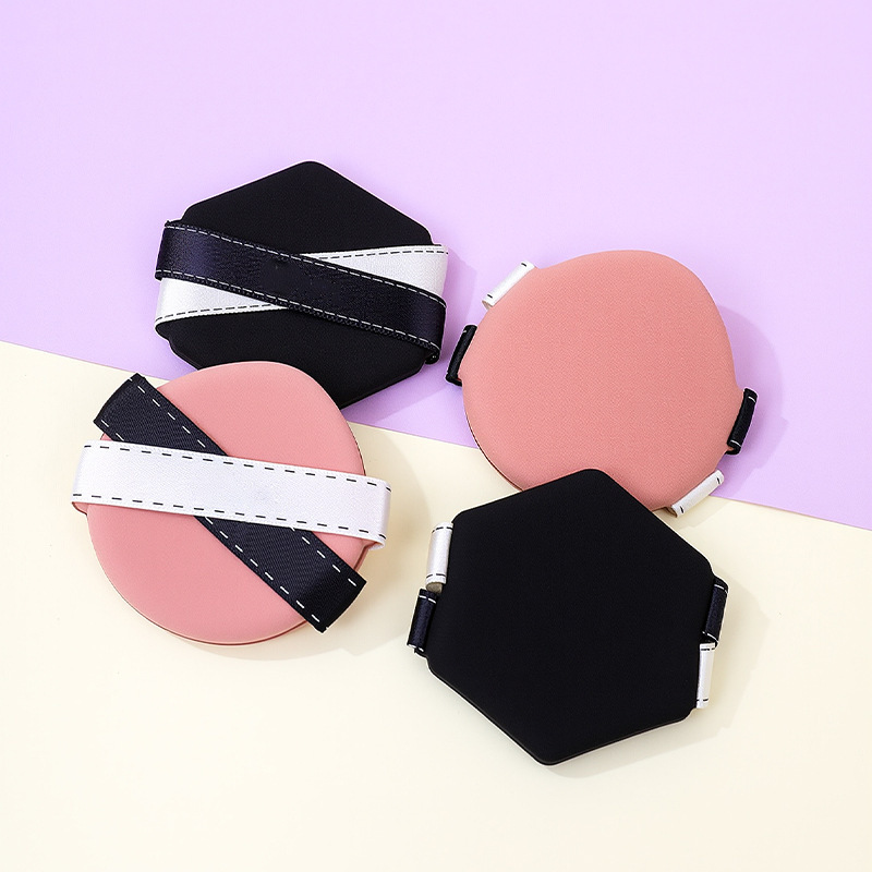 La borla de polvo de cinta de dos colores personalizada de fábrica no come polvo, gotas de agua sin látex, esponja de maquillaje de seis lados en forma de diamante, cojín de aire al por mayor