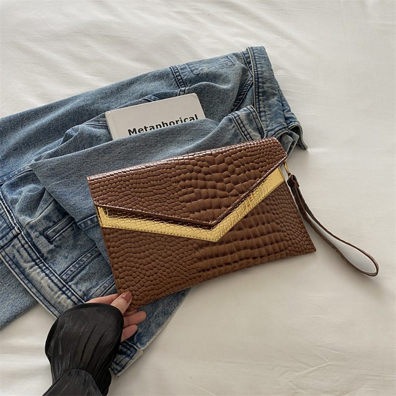 Bolso de mano sobre 2024 otoño nuevo estilo personalidad coreana moda femenina de moda temperamento casual todo-fósforo banquete pequeño bolso