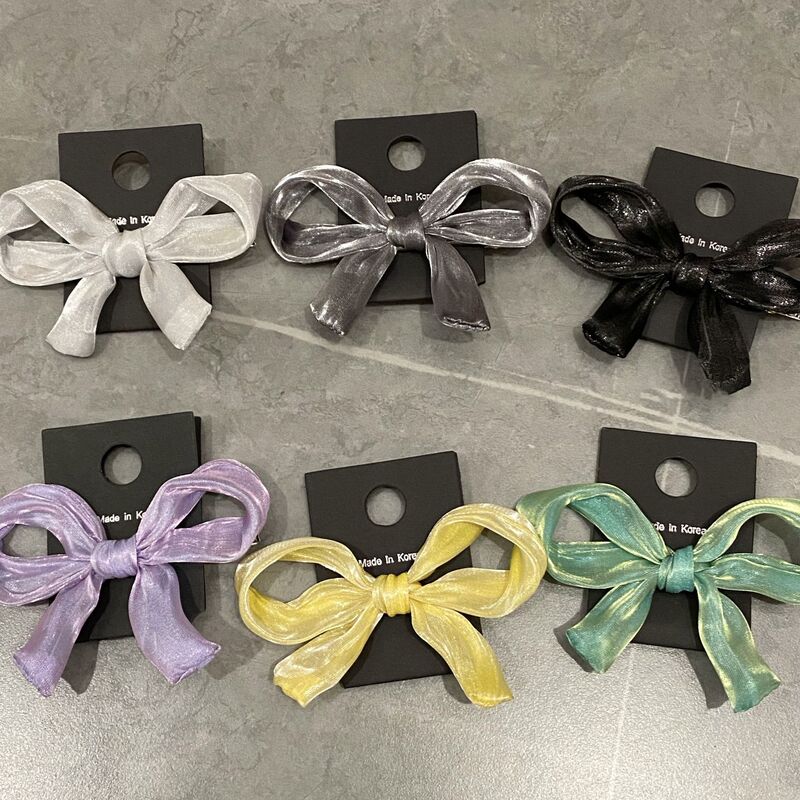 韓国の高級感の超仙光沢感の糸の黄色の蝶結びの前髪クリップの女性の後頭部の半分の髪飾り|undefined
