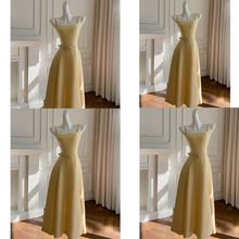 2025夏季新款赫本风黄色简约吊带长裙轻奢感收腰显瘦连衣裙女涤纶