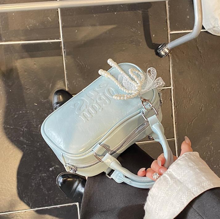 Versión coreana del bolso de bolos de mano para mujer 2025 nuevo bolso de hombro de moda de moda bolso de mensajero popular casual de todo fósforo