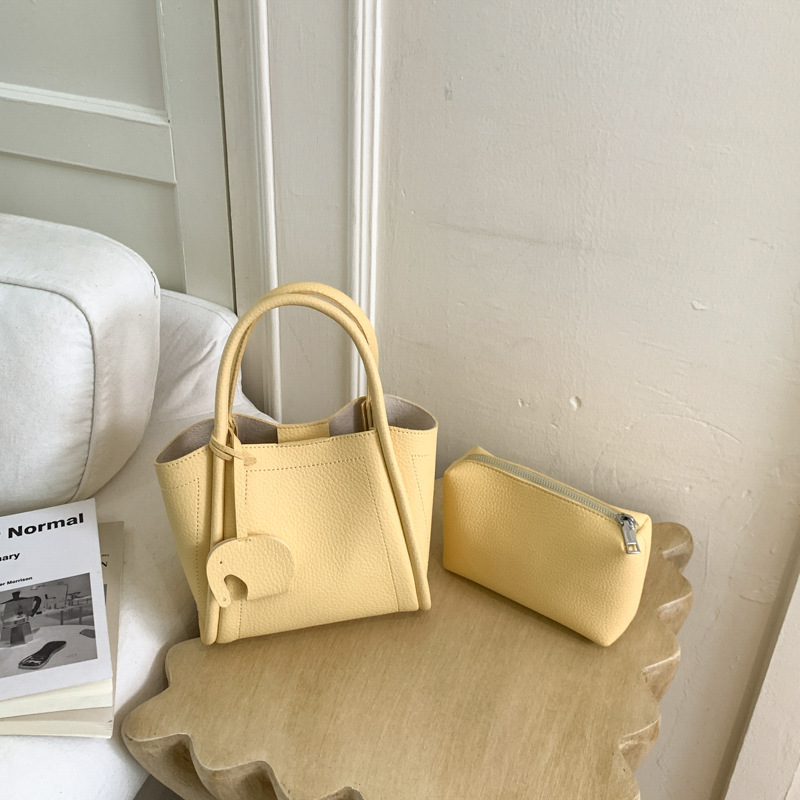 Bolso para mujeres 2026 nuevo estilo de moda bolso de cubo portátil de alta calidad lichi patrón popular lujo ligero mochila casual