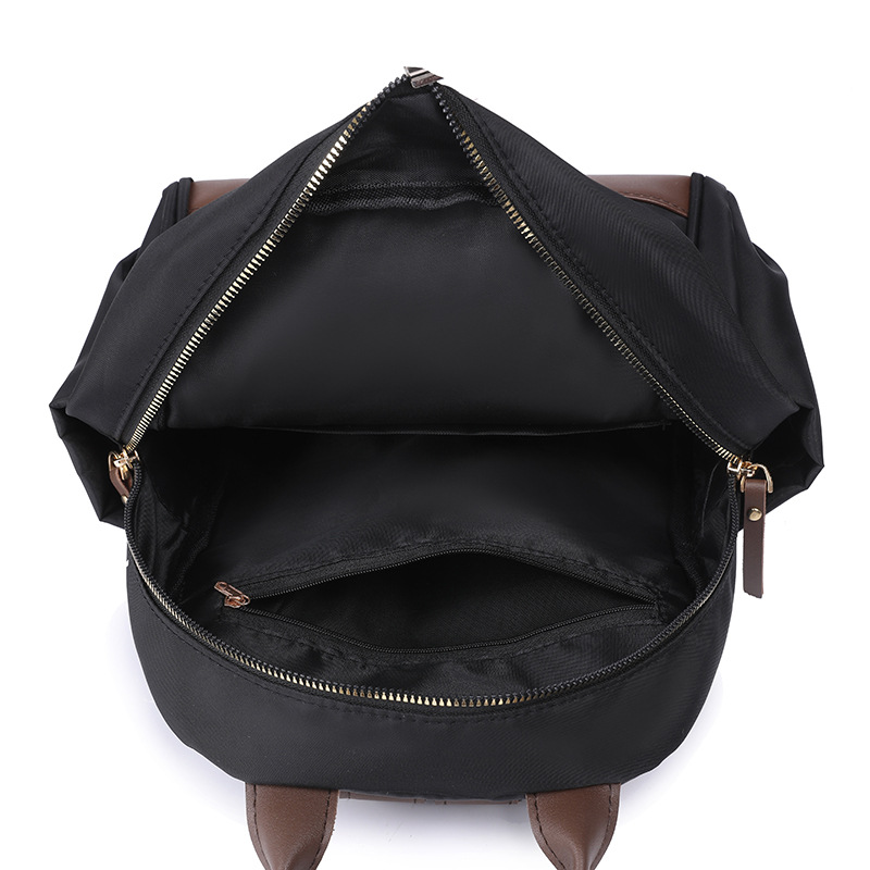 Fábrica al por mayor 2023 nueva mochila de nailon casual para mujer, mochila de viaje urbana simple de moda, mochila escolar