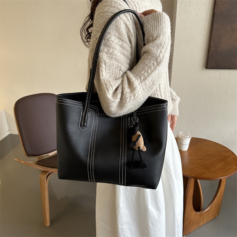 Bolsa de cubo de textura de alta capacidad de moda para mujeres de viaje 2024 otoño y invierno nuevo estilo universal coreano bolso de hombro