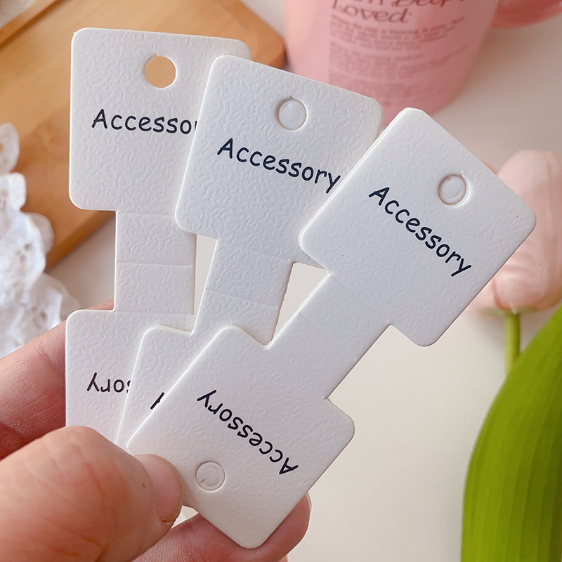 Nuevo engrosado doblado grabado accesorio cabello tarjeta de papel de dibujos animados niños cuerda de embalaje de tarjetas de joyería