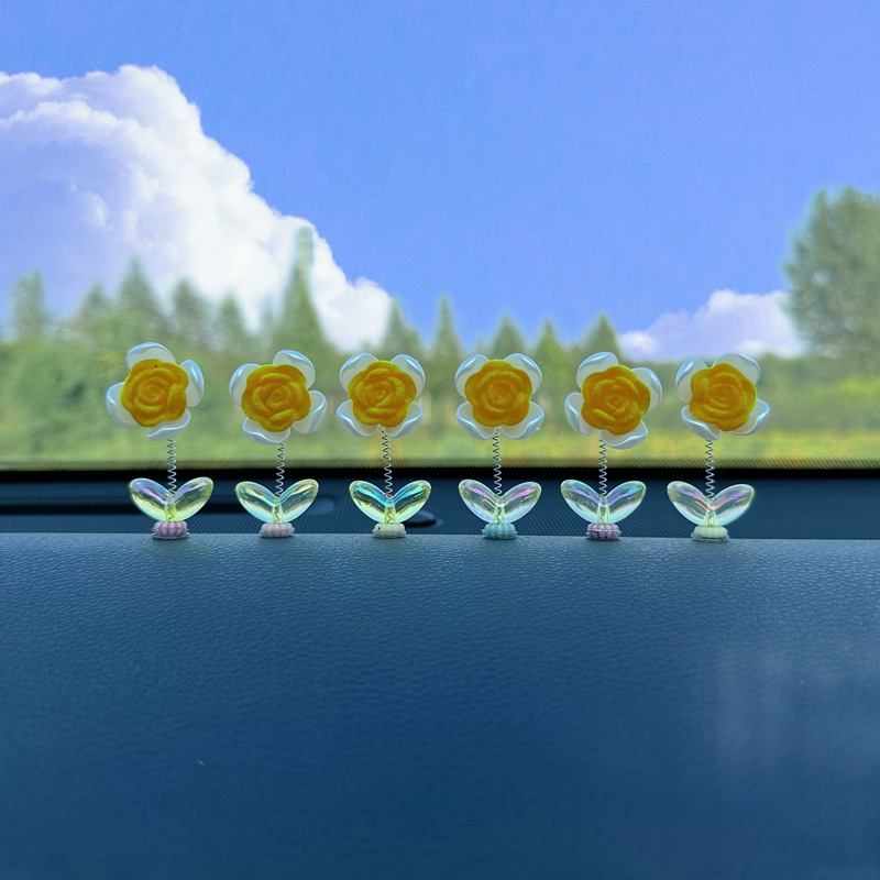Tendencia nuevo producto flocado rosa coche sacudiendo la cabeza pequeños adornos decoración de primavera tablero accesorios de coche ventana