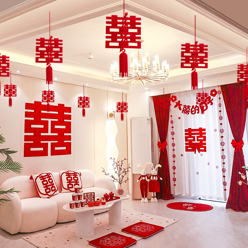 Wedding decoration set for the groom's new wedding room, including ceiling draperies for the living room, paper couplets for the bride's room, and overall wedding room arrangement.