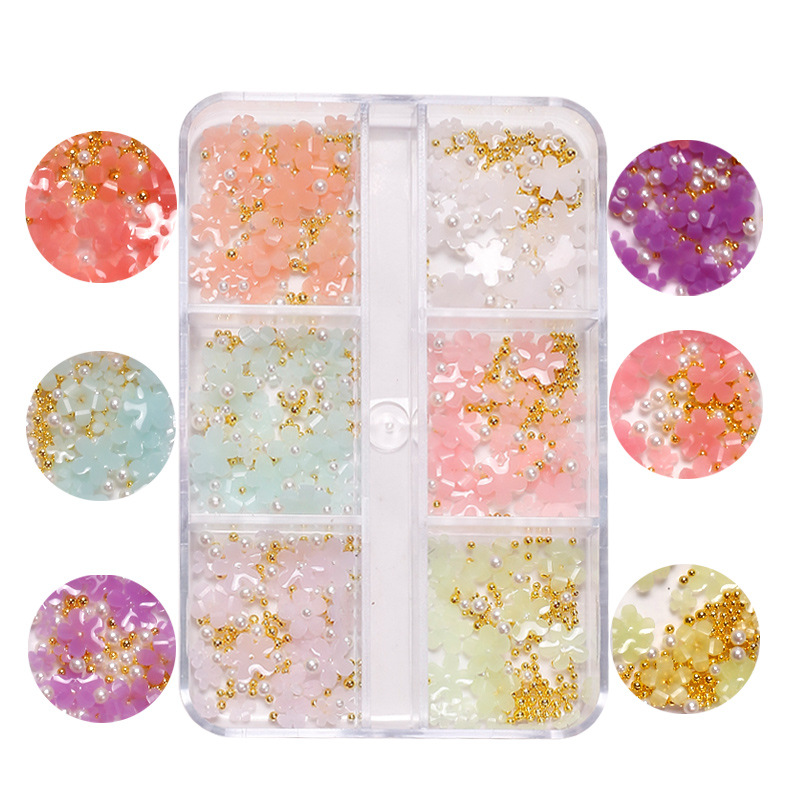 Manicura de estilo japonés joyería de flores de cinco pétalos joyería de flores pequeñas tridimensionales que cambian la luz Internet celebridad resina accesorios de uñas de flores de cinco pétalos