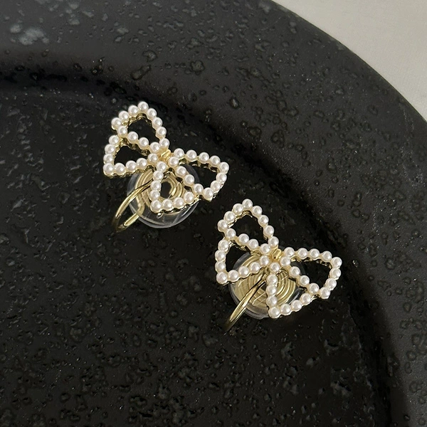 Mosquito coil with bow from pearl, ear clips