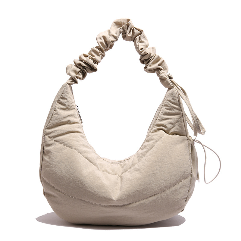 Bolso debajo de la axila para mujeres 2025 primavera nuevo diseño bolso plegado simple nicho bolso de hombro de mujeres