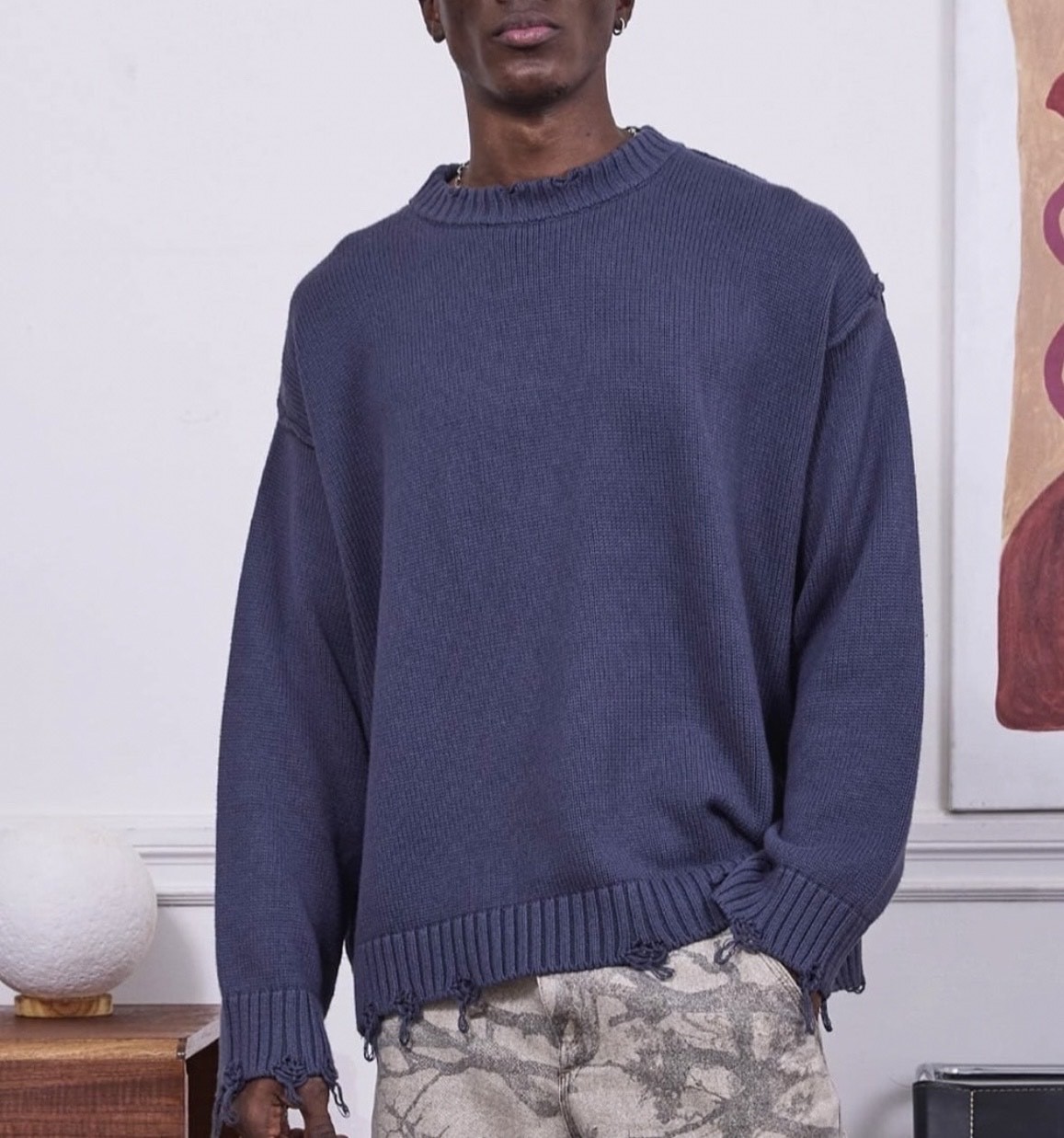 Estación independiente europea y americana otoño e invierno suéter rasgado hombres y mujeres costura de cuello redondo marca de moda retro suéter suelto casual