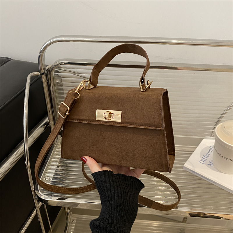 2025 primavera nueva moda simple bolso de mano de cerradura de viaje bolso de hombro retro estilo coreano bolso de mochila pequeña