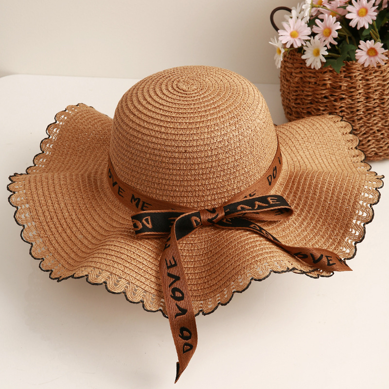 Sombrero de paja de viaje de verano flor sombrero de playa protección solar sombrero de sol ala grande paja tejida a mano arco sombrero de sol