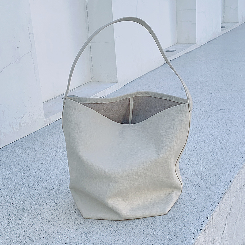 本革レディースバッグ、第一層牛革、都会的でシンプルな大容量バケットバッグ、トーゴ高級バッグ革メーカー卸売