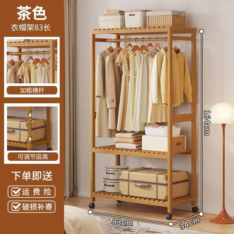 ハンガーを掛けて着地した寝室の家庭用ロッカー付き収納ベッドの上の夜に服を置く楠竹多機能フードラック|undefined
