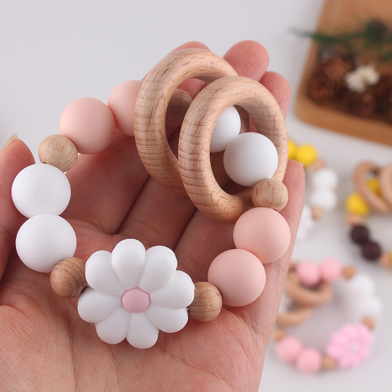 Nuevo juguete de mano para bebé con sonajero, los molares de los niños pueden morder el castaño de haya, margarita, pulsera de flores, mordedor