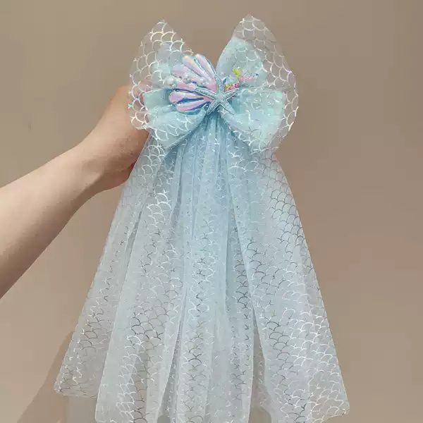 Blue hairgrip with bow
