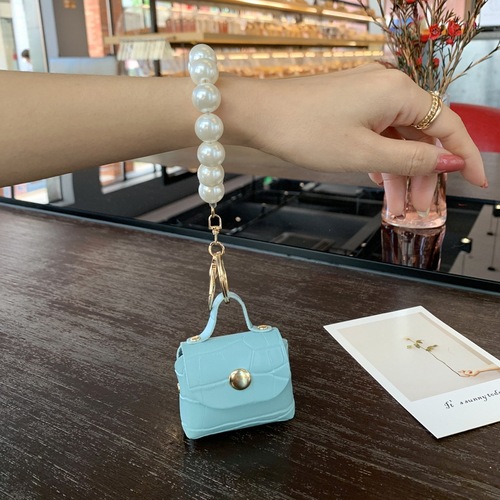 Factory direct sales pearl bag pendant car keychain handmade mini bag accessories jewelry pu leather d buckle wholesale