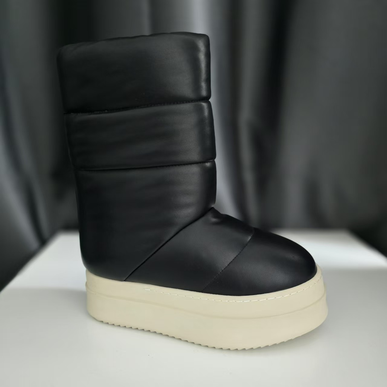 Black glossy sheepskin boots