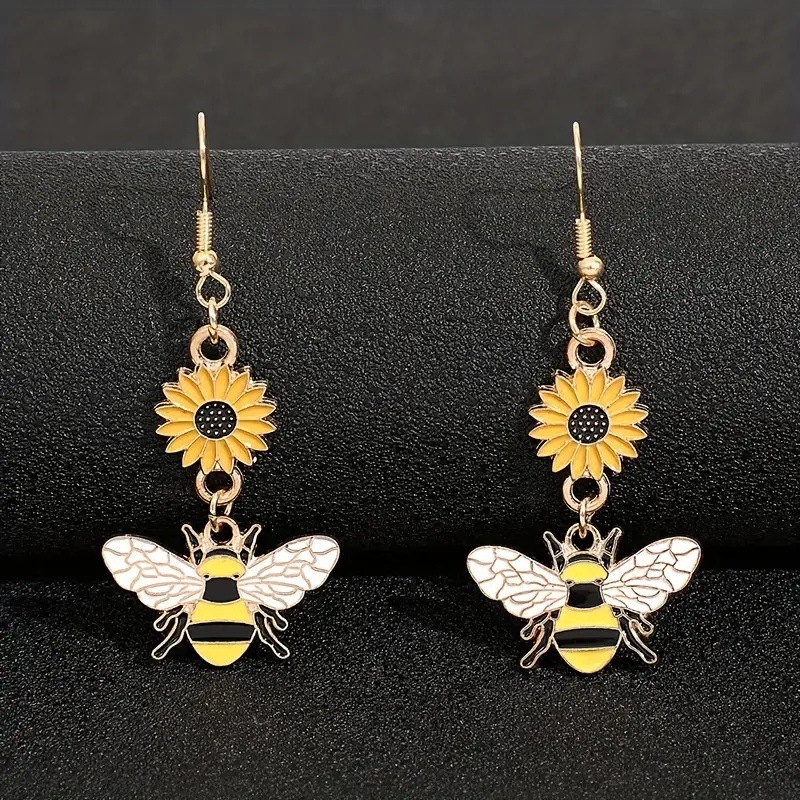 Suxin transfronterizo Europa y América de venta caliente personalidad de dibujos animados pendientes de abeja simple aleación goteo de aceite margarita flores pendientes para mujeres