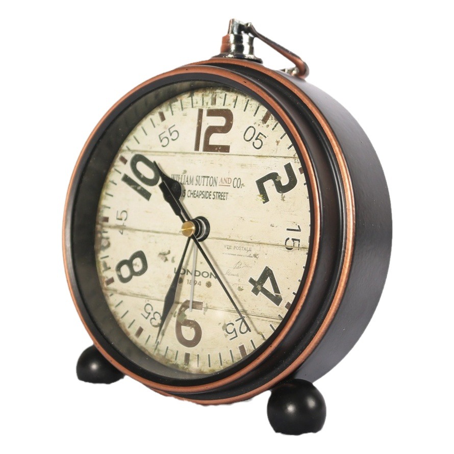 Reloj de hierro retro de estilo europeo alarma creativa Borde de bronce reloj de escritorio mudo negro reloj de asiento venta directa de fábrica al por mayor