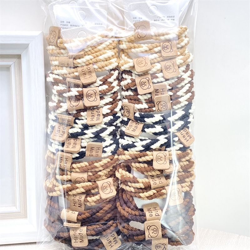 Traje de tarjeta cara sonriente oso etiqueta de cuero leche té color Banda para el cabello corbata de pelo de las mujeres banda de goma supermercado 2 yuanes tienda física accesorios para el cabello