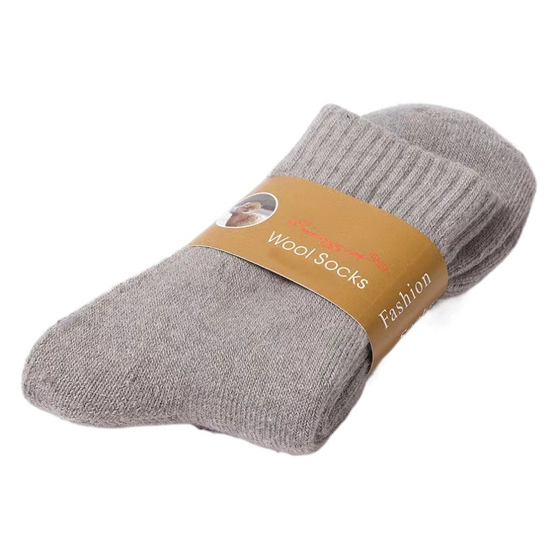 ウールの靴下の男性の秋冬のタイプは厚い純色のカジュアルな毛輪の中筒の靴下のウールは厚い保温の男性のストッキングを作ります。