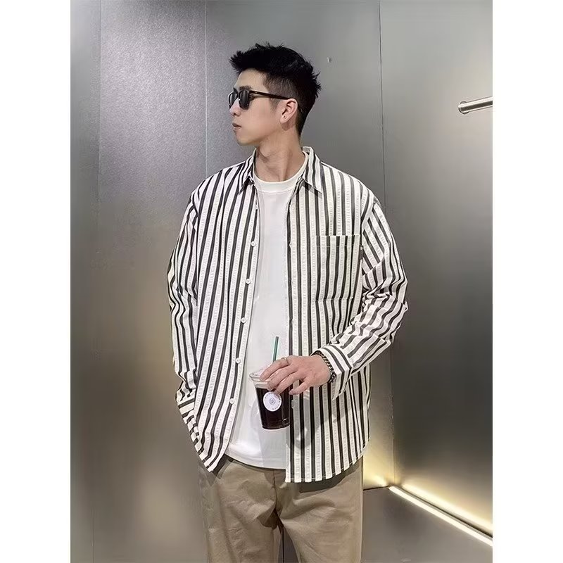 2025 primavera nuevo estilo camisa de alta gama para hombres versión coreana de rayas verticales tendencia camisa guapa camisa casual de negocios