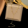 Round beads with tassels, golden necklace