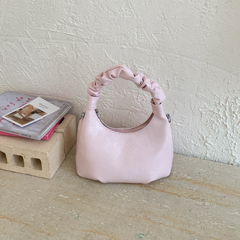 2026 primavera nueva moda temperamento bolso de hombro de moda bolso de arco de moda moda bolso de mano de tendencia diaria plegado mochila
