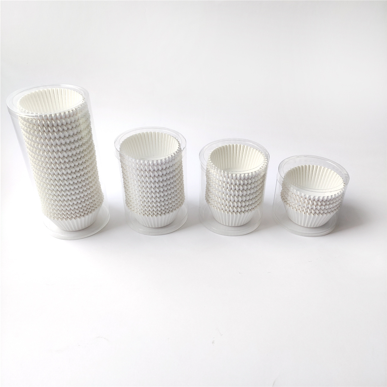 Fábrica directa al por mayor 100% taza de papel de pastel blanco puro 100 barril de papel de horneado resistente a altas temperaturas papel de pastel a prueba de aceite