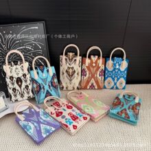 新疆花纹民族风艾德莱斯手机包百搭时尚磁扣翻盖式斜挎手拎单肩包