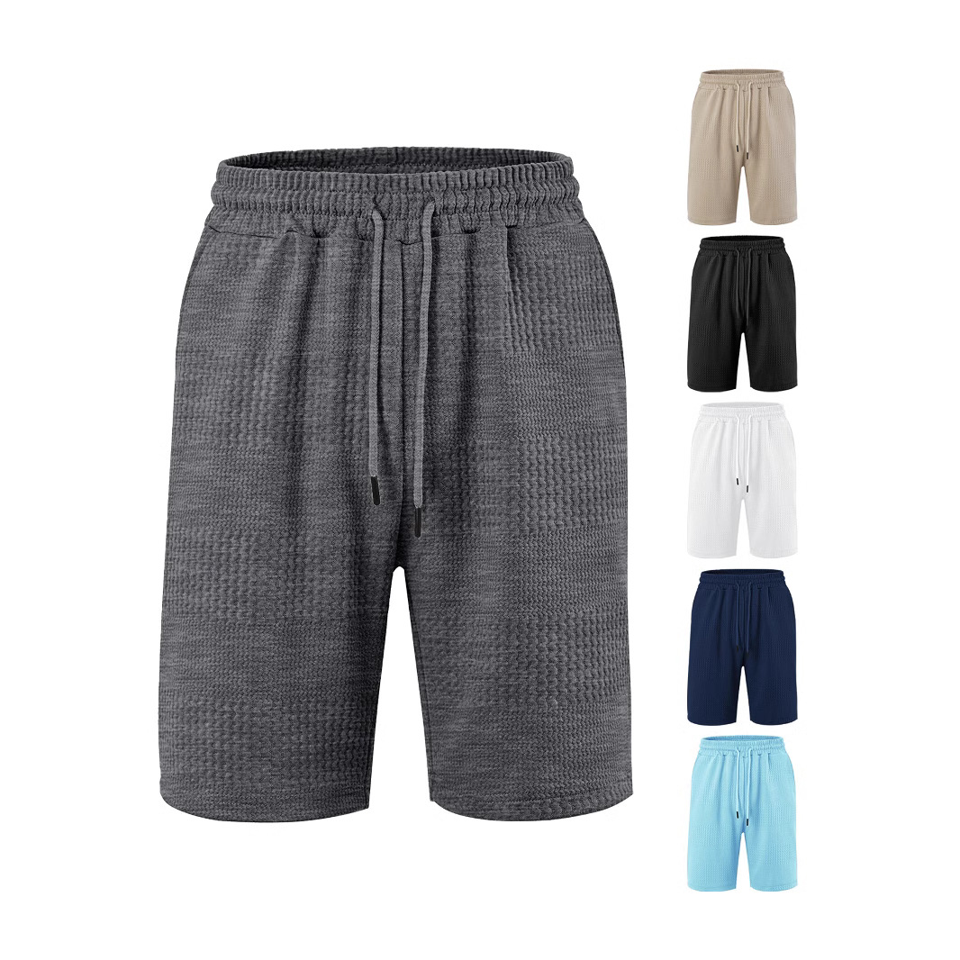 Fábrica europea de ropa de hombre transfronteriza en stock TK paleta suelta tela jacquard de banda larga de hombre pantalones cortos casuales de playa