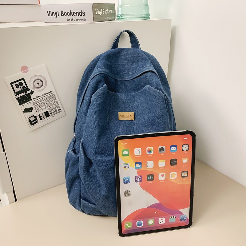 Mochila de mezclilla de gran capacidad para estudiantes de secundaria para mujeres, bolsa de viaje ligera, mochila de ocio estilo de Hong Kong, mochila al por mayor