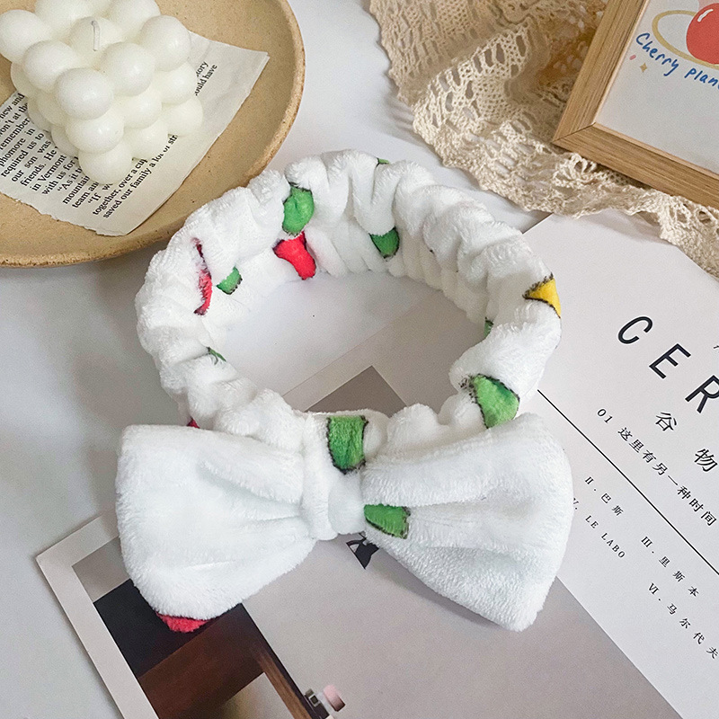 Europa y los Estados Unidos ondulado punto de leopardo coral mariposa fin correa de cabello mujer lavado cara banda de cabello rayas transfronterizas peluche adornamientos para el cabello al por mayor