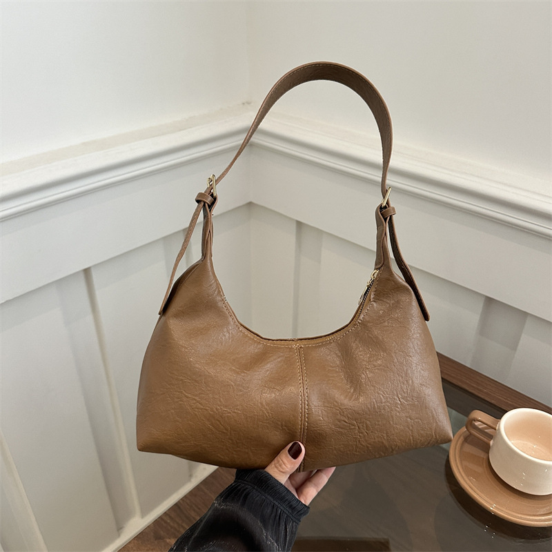 Bolsa coreana de seda texturizada 2024, nuevo nicho de diseño, bolso de palo, bolso de hombro retro de cuero pu.