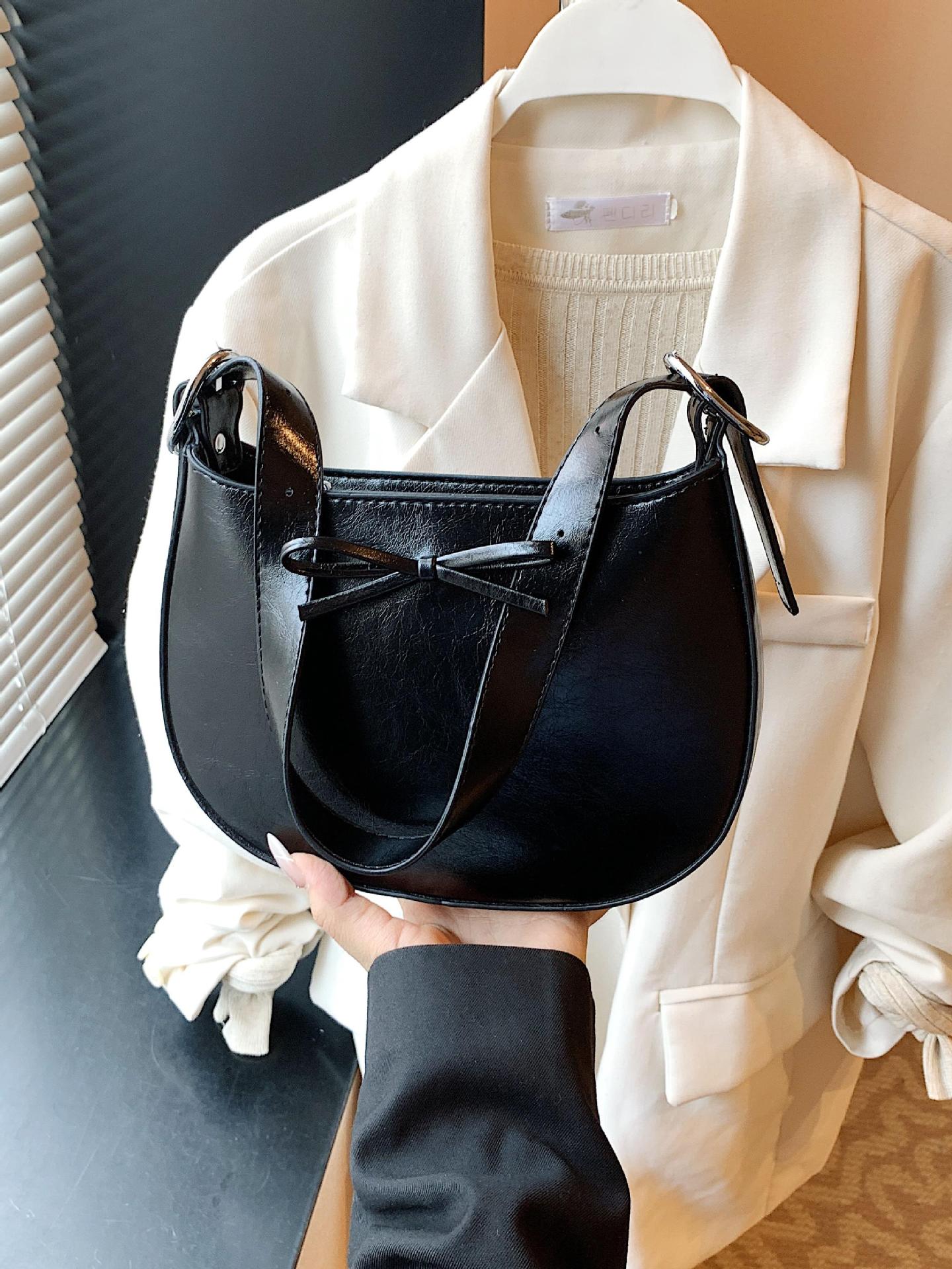 Nicho coreano de lujo ligero arco brazo bolso para mujeres 2025 nuevo estilo versátil bolso de hombro de estilo extranjero bolso de moda