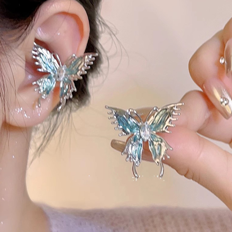 Diseño de nicho de alta gama borla larga sin orejas clip de oreja elegante estilo occidental de las mujeres cara-mirando pequeños nuevos pendientes de moda