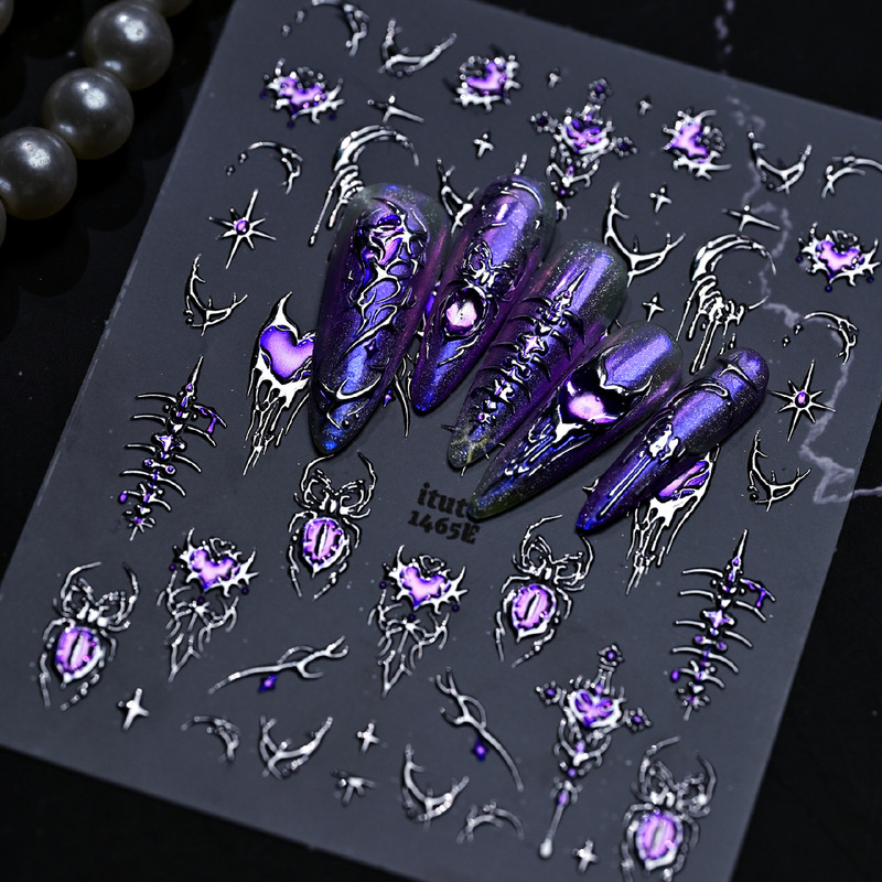 Cross-border dark and cool Halloween nail art stickers: purple cat-eye spider, hot gold and silver, lava, and hollow heart designs Cross-border dark and cool Halloween nail art stickers: purple cat-eye spider, hot gold and silver, lava, and hollow heart designs