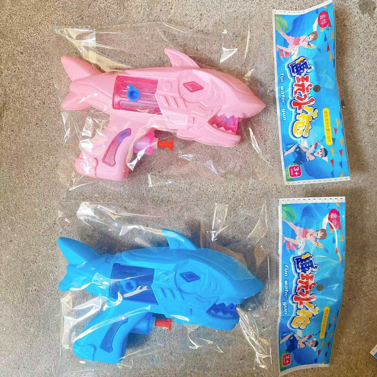 Nueva pistola de agua de dinosaurio, tiburón de color, dibujos animados, pistola de agua de juguete para niños, pistola de agua interactiva de verano
