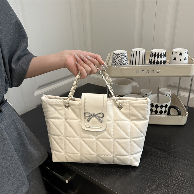 Bolso de hombro de cadena de moda con lazo de gran capacidad para el trabajo para mujer 2025 verano nuevo bolso de nicho