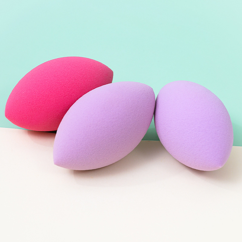 Fábrica personalizada ovalada belleza huevo soplo de polvo no come polvo no látex transfronterizo rugby maquillaje esponja huevo cojín de aire