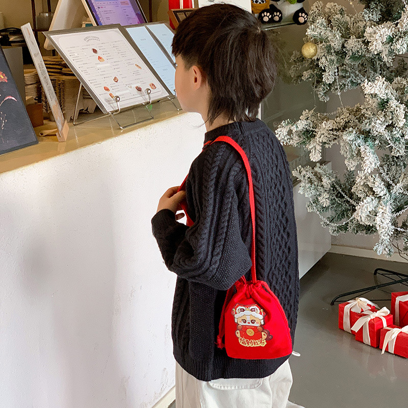2026 Año Nuevo Festival de Primavera bolsas de niños extranjeras cuerda de dibujo lindo bebé bolsa de cambio festiva mini niños sobre rojo de Año Nuevo