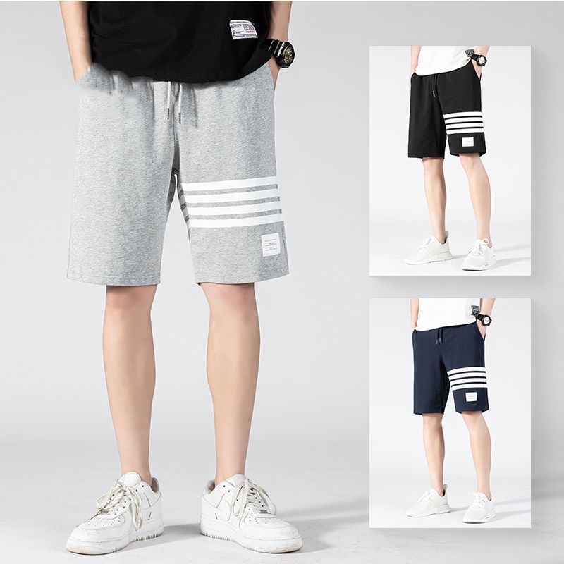 Nuevos pantalones cortos de estilo americano de verano de moda masculino delgado diseño de nicho relajado pantalones deportivos casuales de cinco puntos