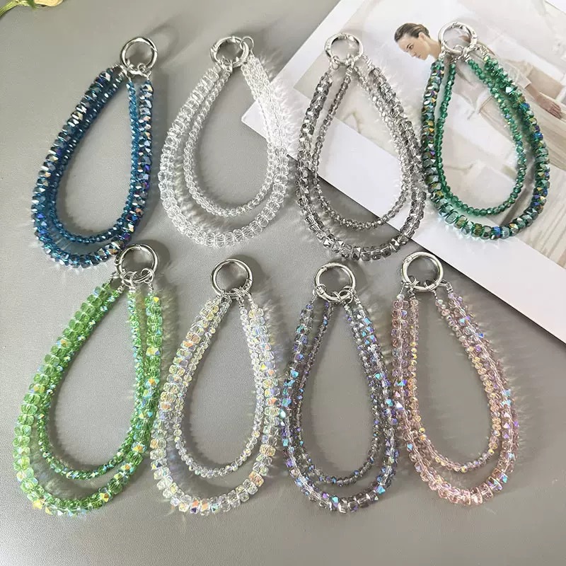 High-end, understated luxury, handcrafted beaded chain phone lanyard, keychain, wristband, universal for mobile phones.