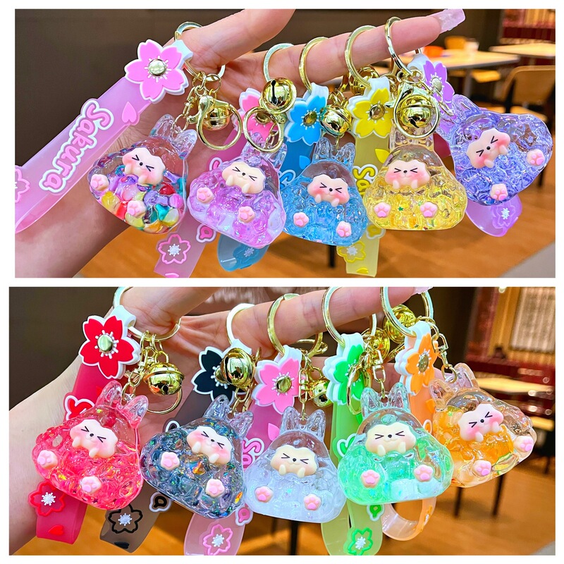 Shake sound explosion luminous creative oil quicksand tower key chain bag pendant key ornaments amusement park gifts